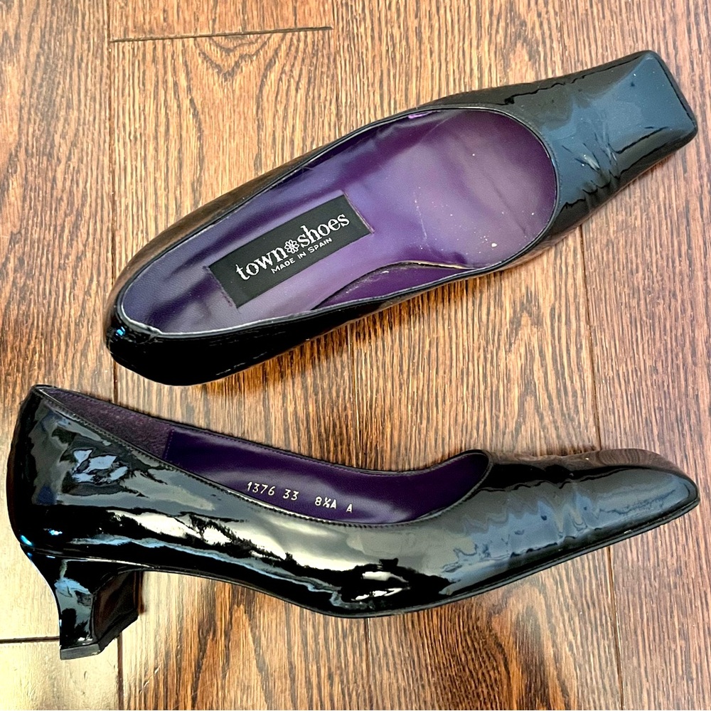 Black patent leather pumps - low kitten heel with square toe and heel profile.